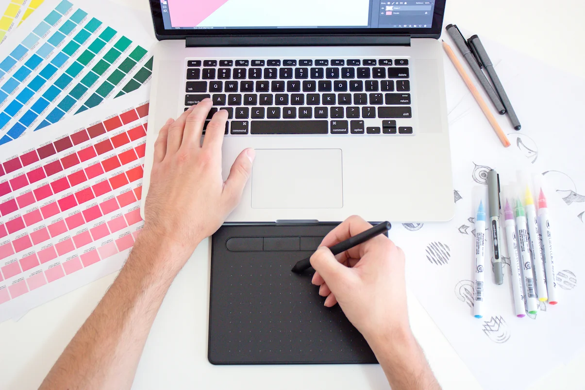 Laptop on a desk with a drawing tablet